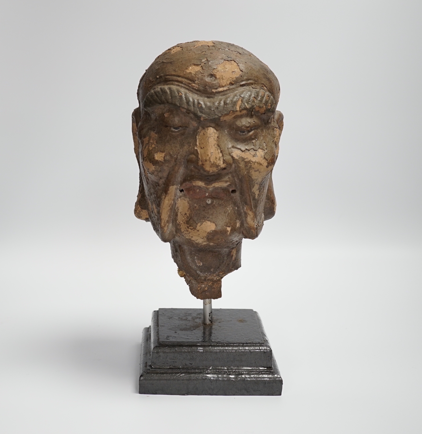 A Chinese lacquered clay head of a luohan, probably Ming dynasty, on stand, head 22cm high